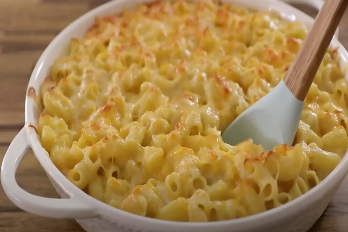 Bowl of creamy homemade mac and cheese with a golden breadcrumb topping.